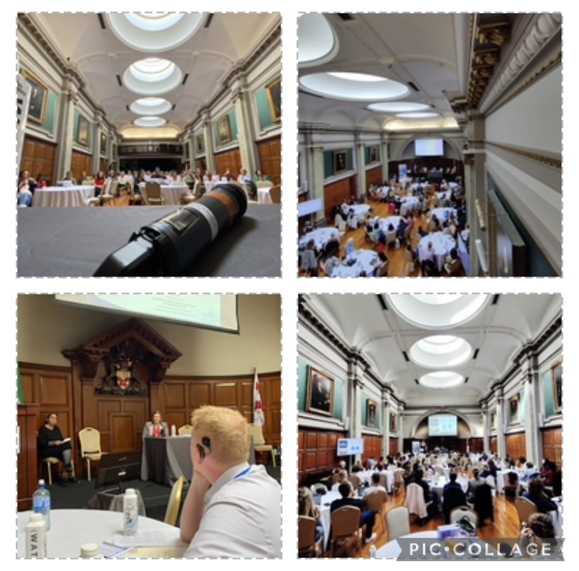 Collage of four photos of a large conference hall with round tables and large round skylights in the ceiling. Man with Cochlear implant sits at the table closest to the stage listening to presenters. 