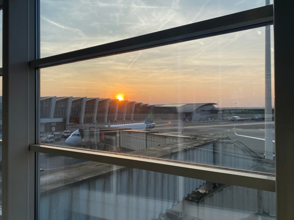 Sunset over Brussels Airport. An Aer Lingus plane is in the foreground. 